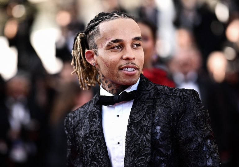 Rapper, 26, who ‘kidnapped and beat teen fan who tried to take a photo of him’ charged after cops raided star’s home