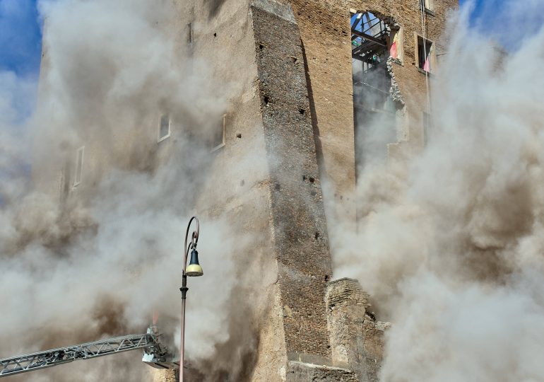 Shock moment ancient Rome tower COLLAPSES in front of terrified tourists near Colosseum leaving one trapped in rubble