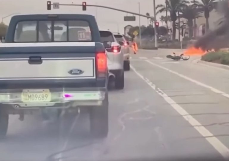 Shocking moment dirt bike EXPLODES in fireball leaving teen rider on fire in horrific sideswipe crash