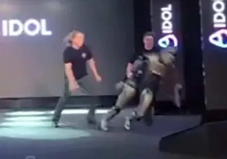 Humiliating moment Russia’s new humanoid robot collapses on stage after staggering just a few steps at grand unveiling