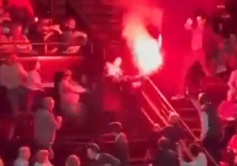 Dramatic moment pro-Palestine protester receives a brutal beatdown after lighting a FLARE at classical music performance