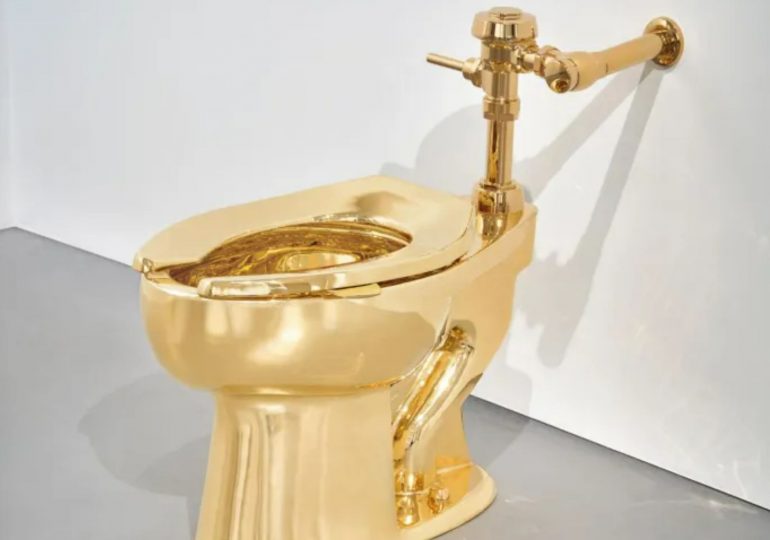 Solid gold toilet ‘artwork’ created by infamous artist who taped a banana to a wall sells for £9.5m – and it works