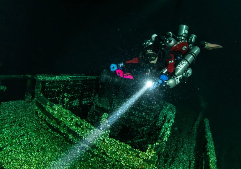 Mystery as divers stumble on 200-year-old shipwreck still perfectly preserved with its mast still standing