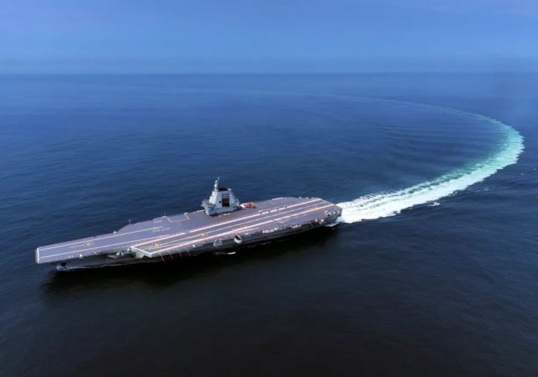 China debuts its BIGGEST aircraft carrier as 1,000ft behemoth with VERY telling name enters service amid Taiwan plotting