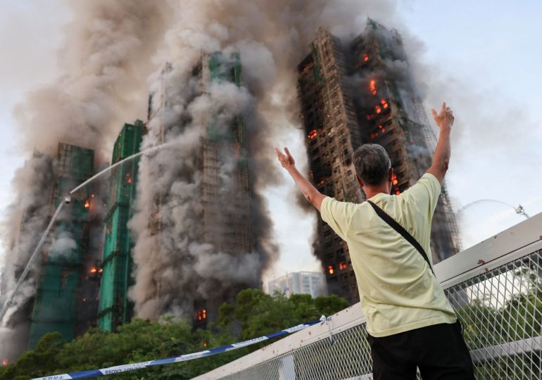 At least 4 dead as horror fire engulfs THREE 31-floor high rise apartment buildings with residents trapped in Hong Kong