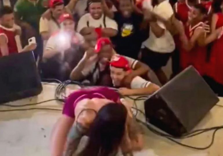 Shock moment knickerless OnlyFans star TWERKS at rowdy school event before woman storms stage & principal issues apology