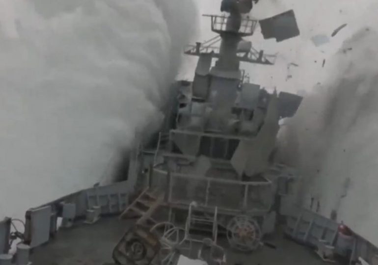 Stunning moment Nato submarine torpedoes frigate in exercise as ship erupts into the air & containers fall off