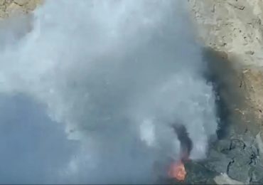 Shocking moment massive wave smashes into tourist posing for photos on rocks as she is dragged into sea