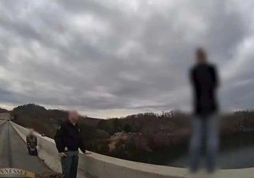 Heartstopping moment hero cop stops distraught woman from leaping off bridge on Boxing Day