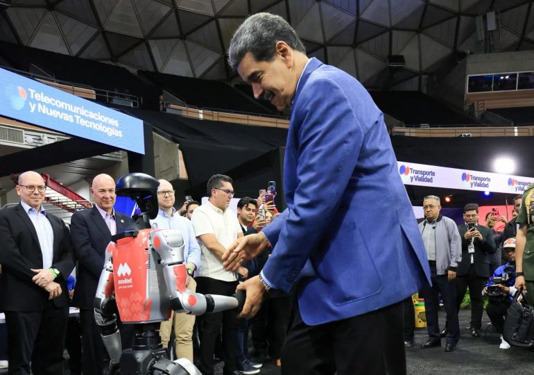 Awkward moment Venezuela tyrant Maduro salsas with robot as US flies special operations troops into Caribbean