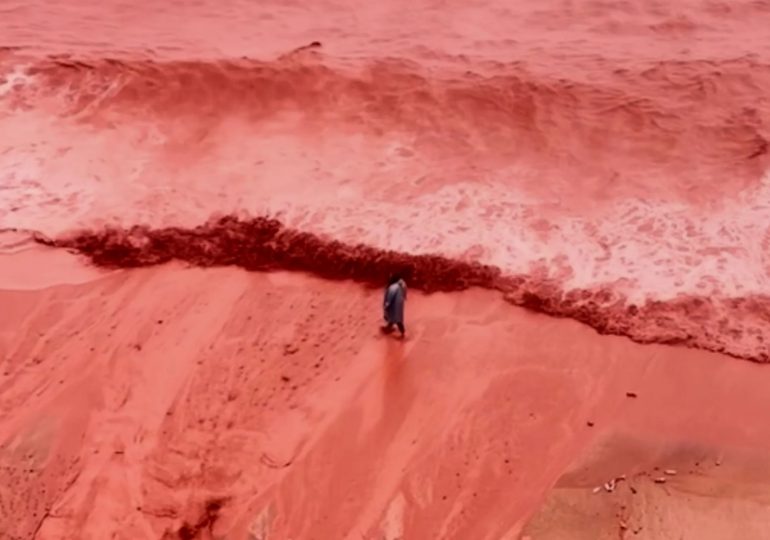 Haunting moment ‘blood rain’ weather phenomenon turns beach bright RED