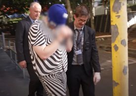 Moment armed cops break down door of ‘satanic paedo ring’ apartment as four charged over horrific crimes