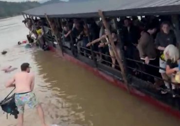 Terrifying moment tourist ferry fills with water in Laos sending Brits scrambling to safety