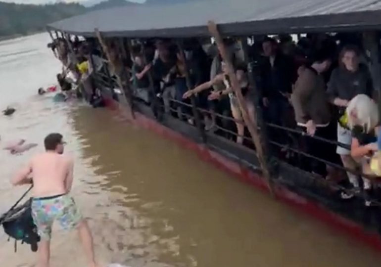 Terrifying moment tourist ferry fills with water in Laos sending Brits scrambling to safety