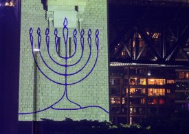 Sydney holds tribute to Bondi terror victims before New Year fireworks as Harbour Bridge is lit up in Jewish Menorah