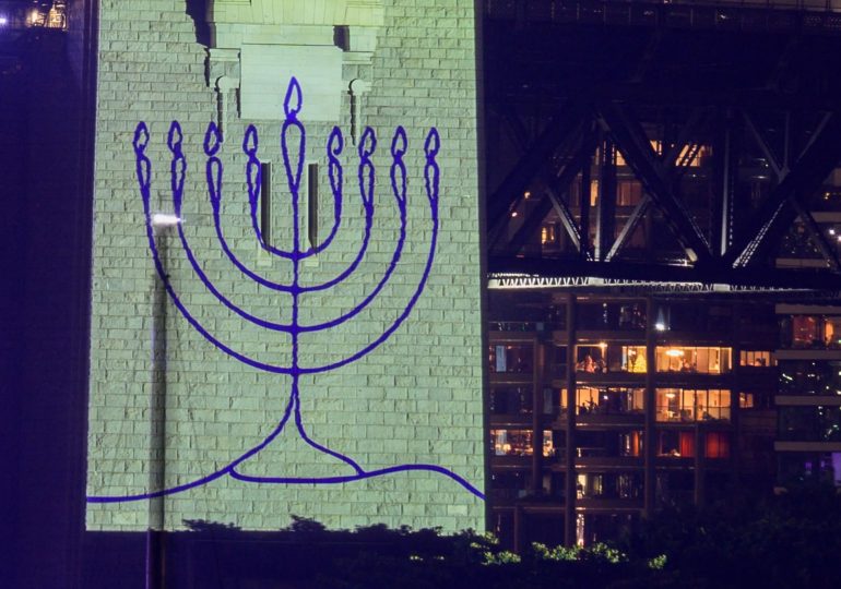 Sydney holds tribute to Bondi terror victims before New Year fireworks as Harbour Bridge is lit up in Jewish Menorah
