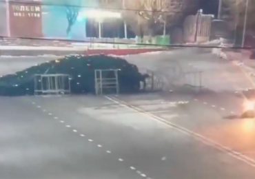 Bizarre moment driver smashes & topples 40ft Christmas tree in town’s main square on crazed joyride in clapped-out motor