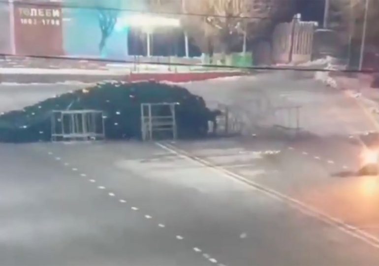 Bizarre moment driver smashes & topples 40ft Christmas tree in town’s main square on crazed joyride in clapped-out motor