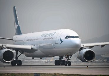 Passenger, 20, arrested after trying to open plane’s door mid-air on Cathay Pacific flight