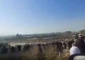 Chilling moment Wembley-sized crowd gathers ‘to see boy, 13, execute family’s killer in Taliban’s medieval Afghanistan’