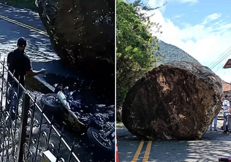 Terrifying moment locals run for their lives as giant boulder rolls down road & crushes motorbike after falling off hill