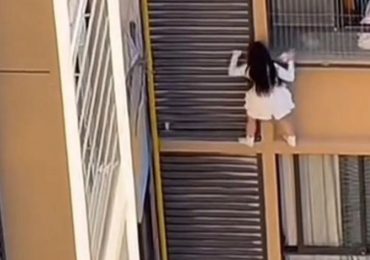 Terrifying moment mistress nearly plunges to her death from 10th floor window while escaping from lover’s wife