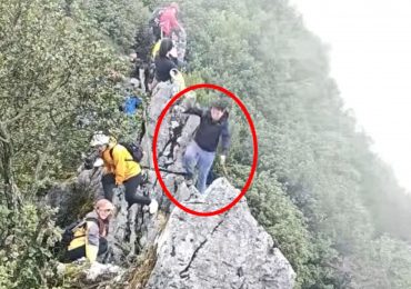 Horror moment tourist plunges off 130ft cliff while trying to take a selfie as onlookers scream in terror