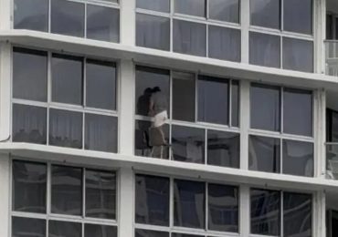 Heart-stopping moment homeowner cleans windows on tiny 16th-floor window ledge