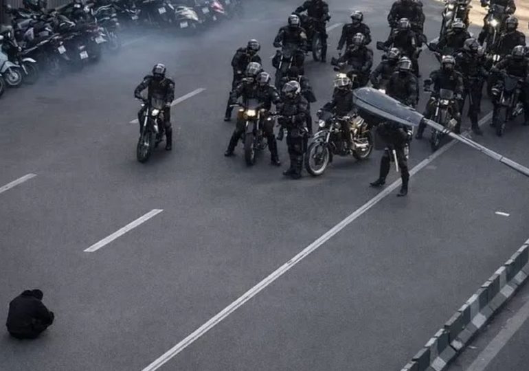 Brave solo protester faces down Iran’s brutal riot cops in Tiananmen Square-style moment as anti-regime unrest swells