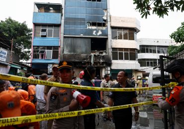 Pregnant woman among at least 22 killed as inferno rips through office building in Indonesia leaving people trapped