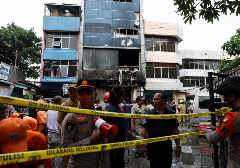 Pregnant woman among at least 22 killed as inferno rips through office building in Indonesia leaving people trapped