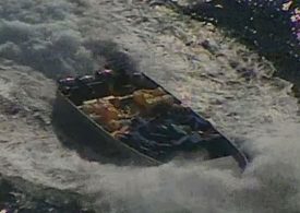 Moment US sniper opens fire on narco boat before seizing massive haul of cocaine