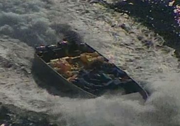 Moment US sniper opens fire on narco boat before seizing massive haul of cocaine