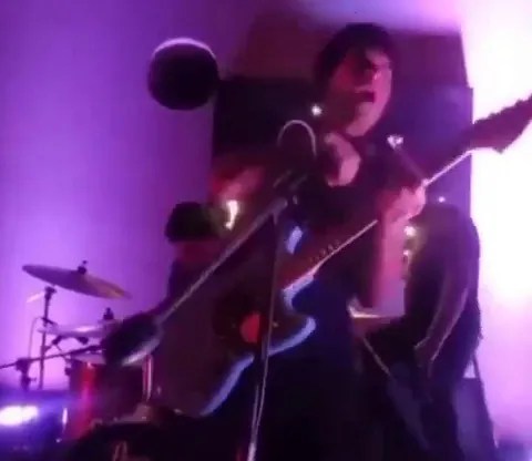 Horror moment singer is electrocuted by own mic as sparks fly from cable & leave frontman screaming in agony on floor