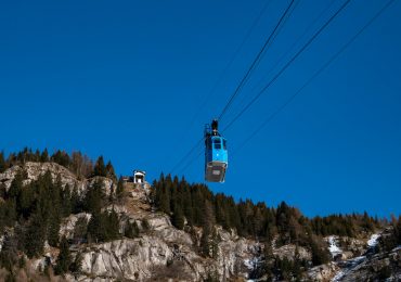 Two injured and more than 100 stranded as cable car slams into barrier at 9,000ft summit in Italy