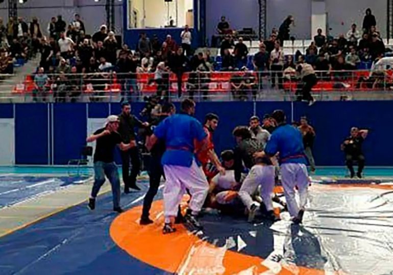 Moment mass brawl erupts at wrestling contest with punches thrown after Putin’s police lose control in occupied Crimea