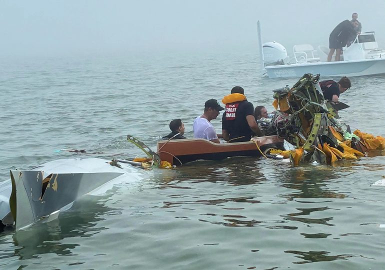 Toddler among five dead after navy plane carrying burn patients crashes into estuary as rescuers search for one missing