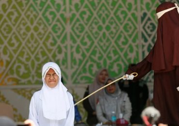 Brutal moment woman FAINTS after being lashed 140 times in agonising Sharia punishment for having sex outside marriage