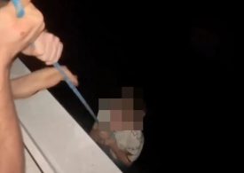 Heart-stopping moment ‘drunk’ dad dangles son on rope from 80ft high tower block window as youngster pleads ‘hold me’