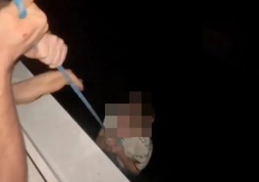 Heart-stopping moment ‘drunk’ dad dangles son on rope from 80ft high tower block window as youngster pleads ‘hold me’