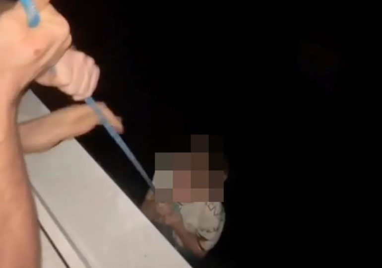 Heart-stopping moment ‘drunk’ dad dangles son on rope from 80ft high tower block window as youngster pleads ‘hold me’