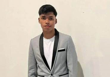 Teen footballer drowns after plunging into lake while paddleboarding as brother, 11, is rescued from water