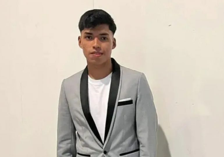 Teen footballer drowns after plunging into lake while paddleboarding as brother, 11, is rescued from water