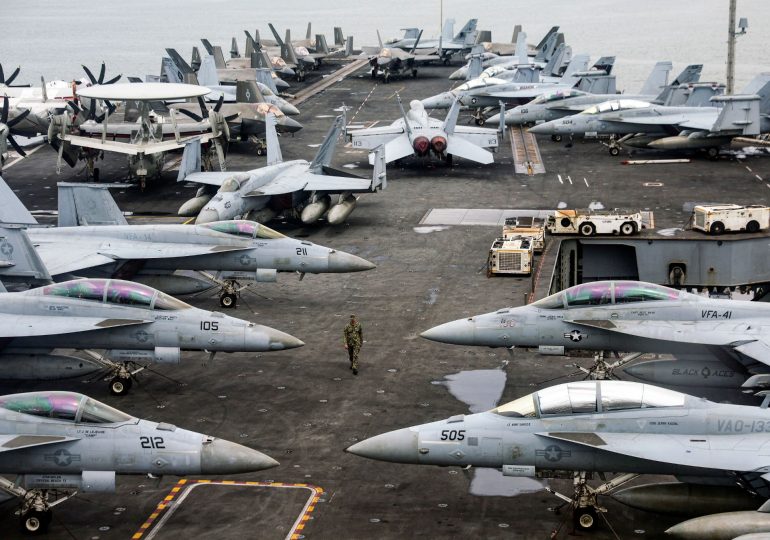 Inside vast USS Abraham Lincoln bristling with bombers Trump has deployed to Middle East…as Iran issues chilling warning