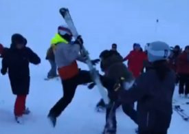 Moment snowboarders & skier brawl in the snow on mountain slope after argument breaks out following crash