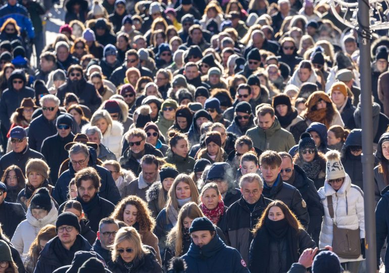 Silent procession of 2,000 mourners fills streets in poignant tribute after 40 killed in horror blaze at Swiss ski bar
