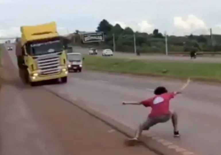 Terrifying moment idiot teen plays twisted game of ‘chicken’ with huge 12-wheeler lorry nearly causing horror crash