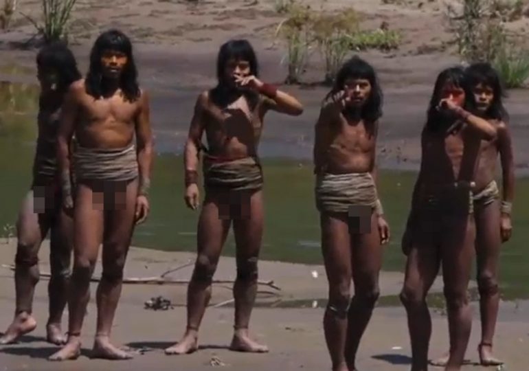 Never-before-seen HD footage of uncontacted Amazon tribe emerges – as arrow-armed tribesmen give unexpected reaction