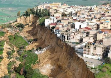 Terrifying vid shows houses teetering on edge of cliff after 4km-long landslide as more than 1,000 evacuate in Sicily