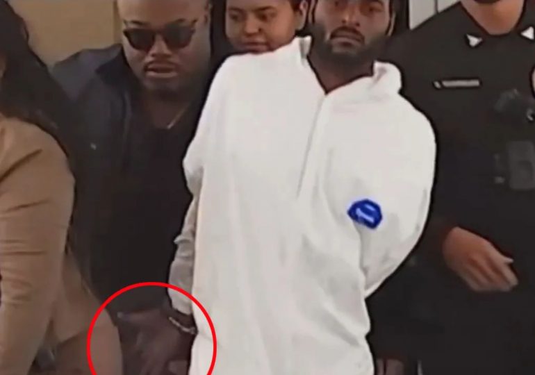 Shocking moment arrested sex attack suspect brazenly tries to GROPE female detective while being taken to jail in cuffs